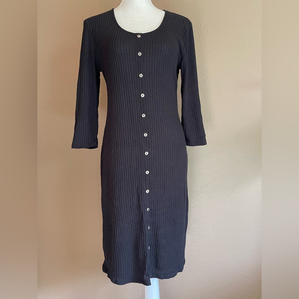 Black, long sleeve dress with decorative buttons.